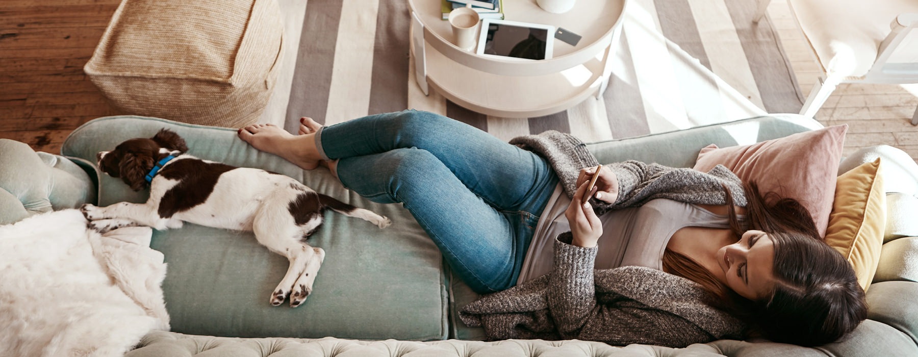 Woman on a sofa with her dog