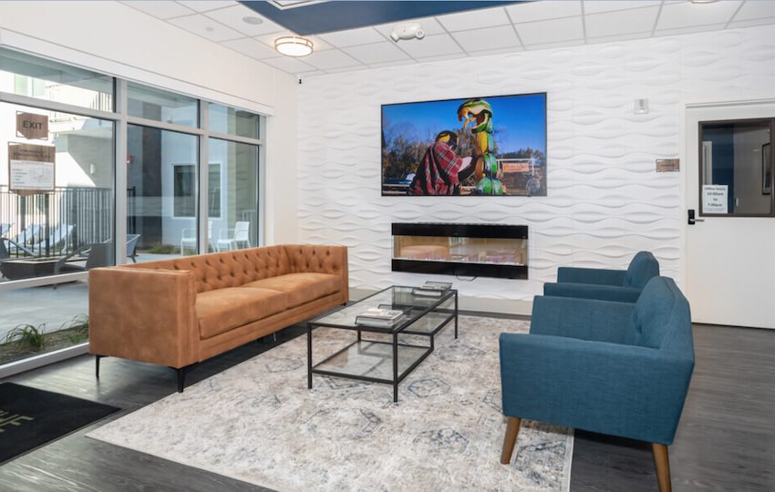 Community room with tv and fireplace